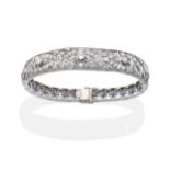 An Art Deco Diamond and Sapphire Bracelet, a central panel of articulated pierced links set