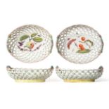 A Pair of Derby Porcelain Baskets, circa 1760, of oval form, painted with fruiting branches and