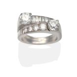 A Diamond Cross-Over Ring, two old cut diamonds in white claw settings to angular cross-over