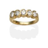 An 18 Carat Gold Diamond Five Stone Ring, round brilliant cut diamonds in half rubbed over scroll