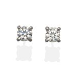 A Pair of 18 Carat White Gold Diamond Solitaire Earrings, a round brilliant cut diamond in a claw