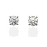 A Pair of 18 Carat White Gold Diamond Solitaire Earrings, a round brilliant cut diamond in a claw