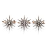 A Set of Three Graduated Victorian Diamond Set Star Brooches, each with a central old cut diamond