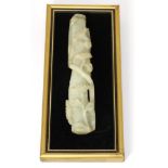 A Chinese Jade Handle, worked in relief with flowering branches, 16.5cm longBroken in half and