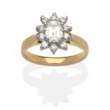 An 18 Carat Gold Diamond Cluster Ring, an octagonal cut diamond within a border of round brilliant