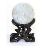 A Jade Disc Pendant, carved with a bat and kylin, the reverse with seal marks, 5cm diameter,