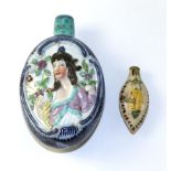 A Pearlware Flask, circa 1800, of oval form, moulded and painted with busts of Ceres holding a