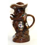 A Measham Bargeware Toby Jug and Cover, dated 1892, as the snuff-taker, applied with flowers and