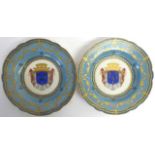 A Pair of Sèvres Style Porcelain Plates, 19th century, painted and gilt with an armorial within a