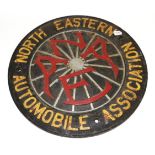 A North Eastern Automobile Association Cast Iron Circular Wall Plaque, early 20th century, the