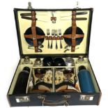 A Sirram Black Leather Picnic Case, early 20th century, comprising two chrome plated food boxes, two