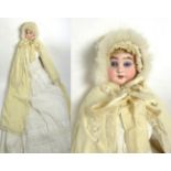 A German Armand Marseille Bisque Head Doll, impressed '1894', on a kid leather jointed body with