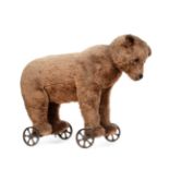 Late 19th / Early 20th Century Bear on Metal Wheels, straw filled and with boot button eyes, small