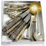 A group of miscellaneous flatware including a Georg Jensen spoon, George III fiddle pattern sifter