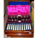 A set of twelve silver teaspoons in a fitted case, a cased set of twelve pairs of fish knives and