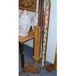 A group of surveyors equipment inlcuding rules, tripods etc