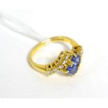 An 18ct gold sapphire and diamond ring