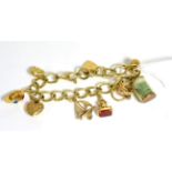 A 9ct gold charm bracelet, with a 9ct gold padlock clasp and seven 9ct gold charms and an unmarked