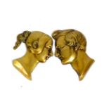 A pair of cast brass portrait plaques of Queen Victoria and Prince Albert in relief