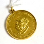 A Winston Churchill 22ct gold commemorative medallion, A.E. Jones, numbered 791 from the edition, in