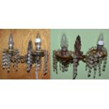 A pair of twin light wall sconces with glass bead drops