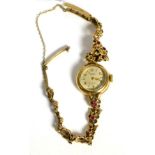 A lady's 9ct gold Rotary wristwatch, bracelet set with small rubies