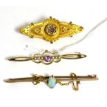 An opal bar brooch, an amethyst and seed pearl brooch and a Victorian brooch (3)