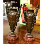 Pair of late 19th century bronze vases on marble bases