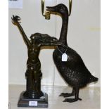 A reproduction bronze of a nude together with a bronze of a duck