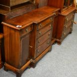A Bevan & Funnell reproduction breakfront cabinet of small proportions