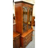 A Bevan & Funnell reproduction mahogany bookcase cabinet