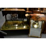 A modern coffee table with atlas decorated top, together with a reproduction sofa table and mirror