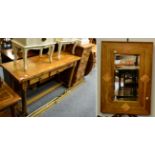 A modern side table fitted with three drawers, together with a matching mirror and a chest fitted