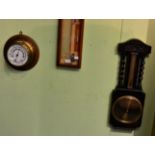 An oak aneroid barometer and a brass cased aneroid barometer (2)