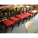 A set of four dining chairs, a pair of dining chairs with similar upholstery and a set of three