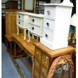 A pair of cream bedside chest of drawers, together with another, a pine hanging corner cupboard,