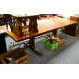 A 1970's Danish Skovby Rosewood Extending Dining Table, with two leaves, on shaped supports joined