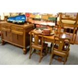 A 1920's oak dining suite comprising table, four chairs and a sideboard