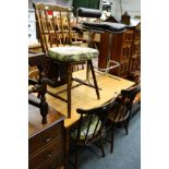 A chrome and leather high stool, together with five various spindle back chairs and a table