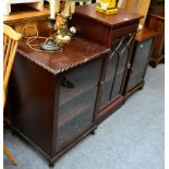 Three glass fronted cabinets