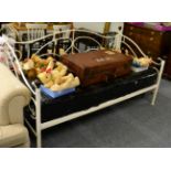 A modern painted metal framed day bed with a new mattress