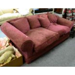 A feather filled four seater sofa