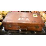 A large leather suitcase by John Pound and Co, Regent Street