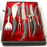 A silver mounted seven piece carving and serving set with antler handles the fitted case with
