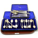 Two silver table spoons, six silver handled knives and a set of twelve bright cut silver spoons with