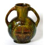 A Linthorpe pottery twin handled vase, shape no. 337, designed by Christopher Dresser