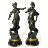 A pair of French spelter figures, ladies holding flowers, one (a.f.)