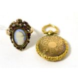 A porcelain portrait miniature, garnet and diamonds set ring, an oval portrait miniature within a