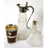 An Edwardian glass claret jug with unusual ribbed body, another claret jug with electroplated