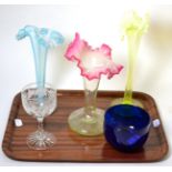 Three Jack in the pulpit vaseline vases, a blue bowl and one large wine glass